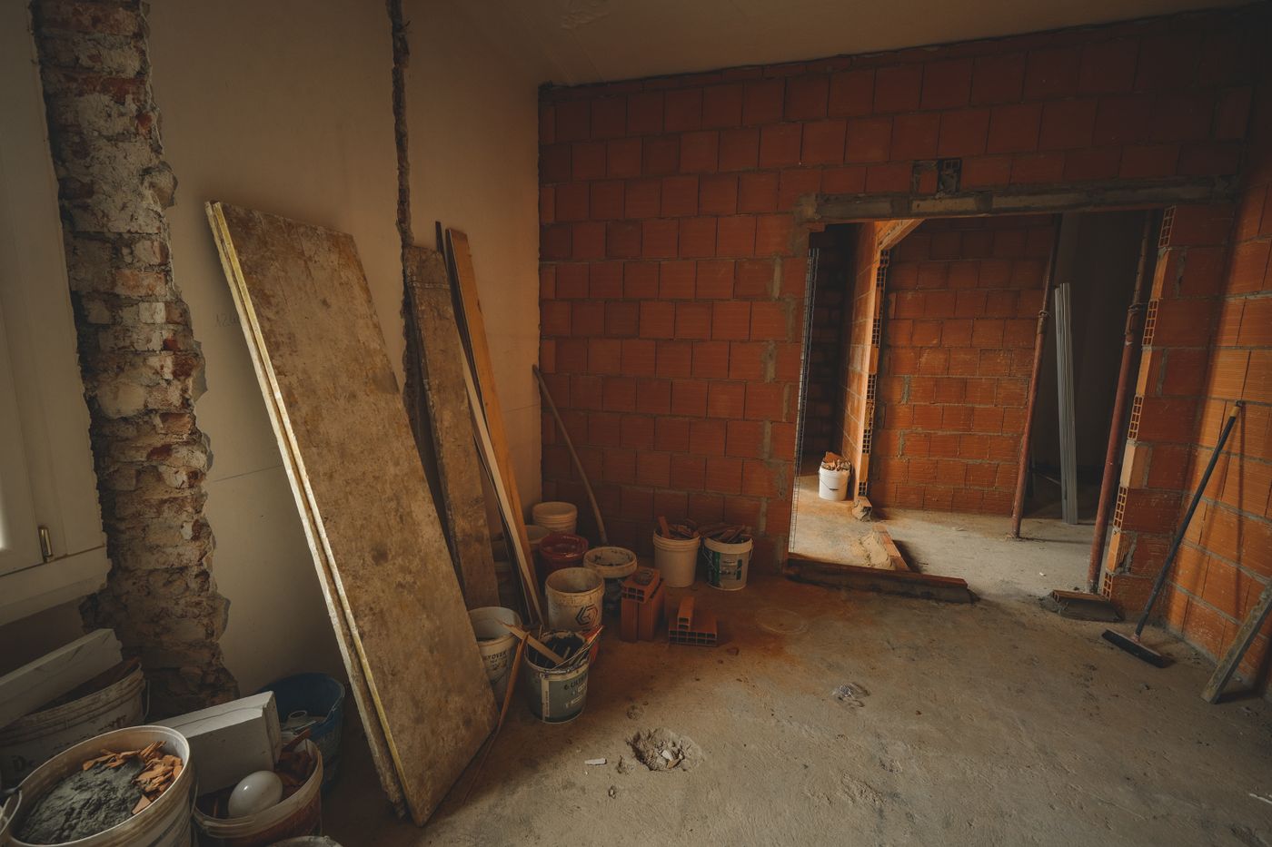 A room stripped back to brick during a structural remodel